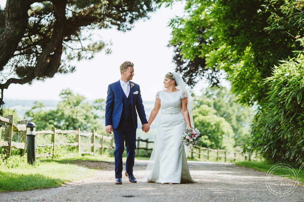 Taking a stroll at Gaynes park wedding