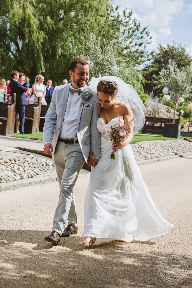 Bride and Groom, just married walk together